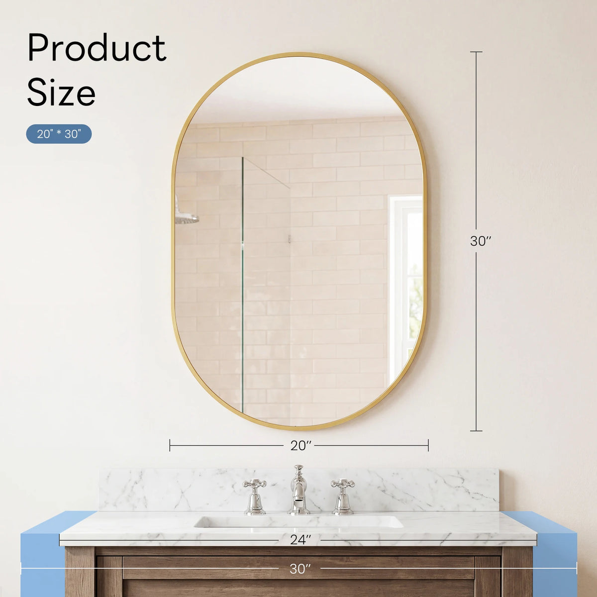 Oval wall mirror with a gold metal frame hanging above a marble vanity countertop.