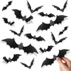 Black bat wall stickers scattered on a white background.