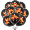 A bunch of black latex balloons shaped like construction tractors and excavators with yellow and red details.