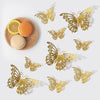 A set of gold butterfly wall decor featuring various sizes and shapes displayed on a light background.