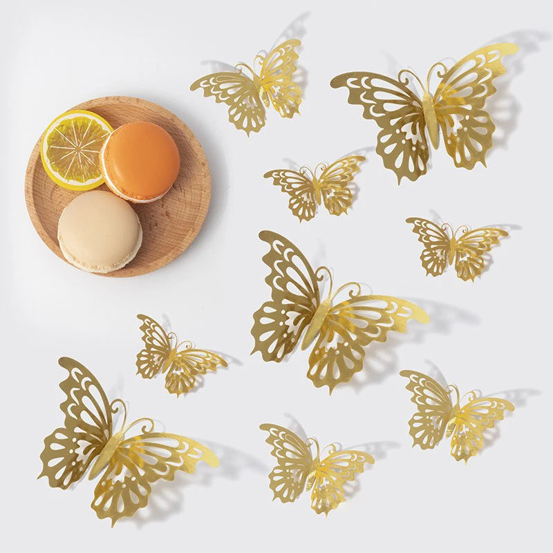 A set of gold butterfly wall decor featuring various sizes and shapes displayed on a light background.