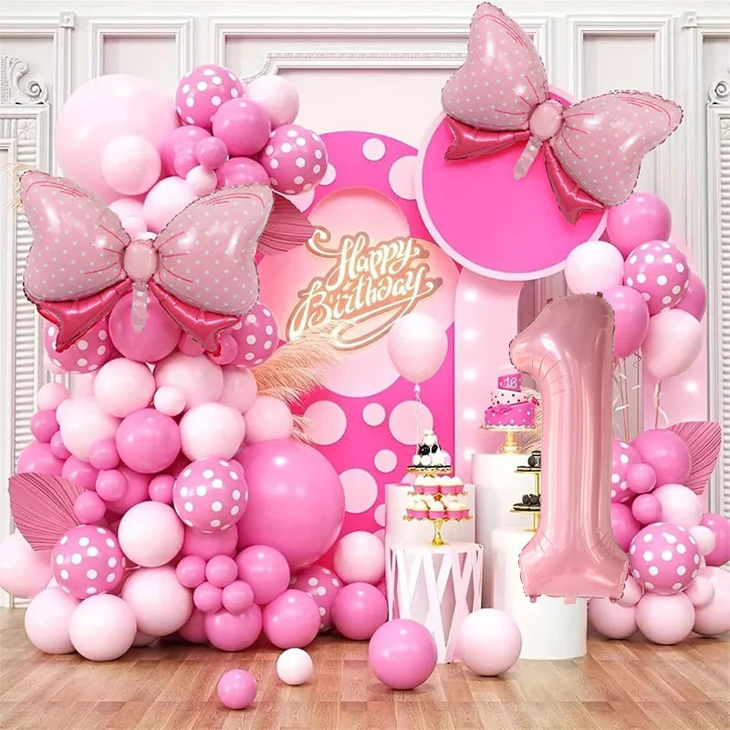 A pink and white balloon garland arch kit featuring numerous balloons in various shades of pink and white.