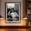 Black and white photograph of a man making a peace sign in a chef's coat displayed in a framed print.