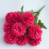 A bouquet of artificial hydrangea and camellia flowers in vibrant pink and magenta tones.