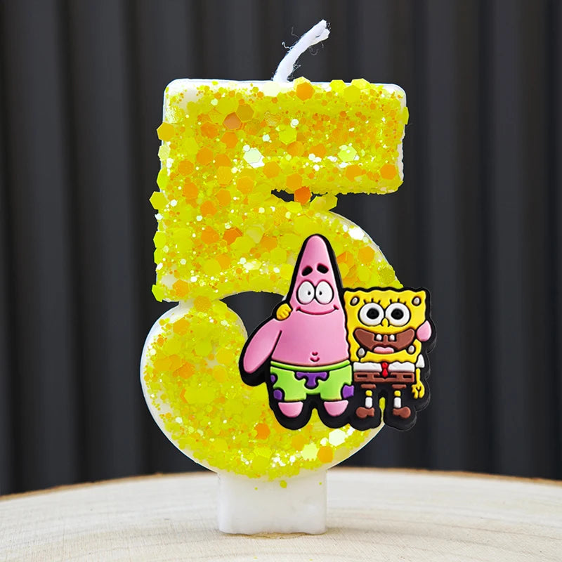 A yellow cake candle shaped like the number 5, featuring SpongeBob SquarePants characters.