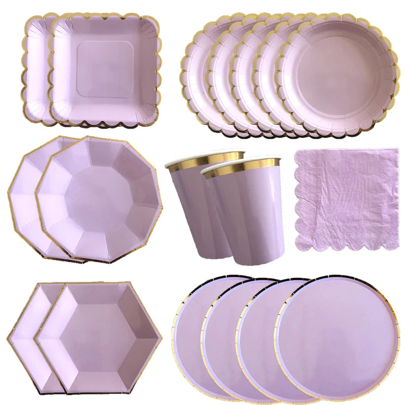 A set of purple and gold party tableware including square plates, round plates, and hexagonal plates.
