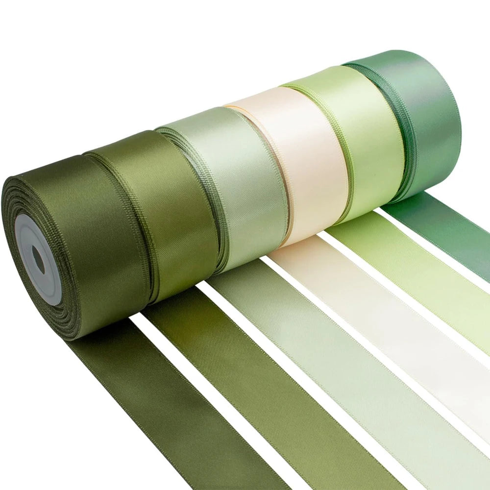 Roll of satin silk ribbon in olive green and pale peach colors displayed horizontally.