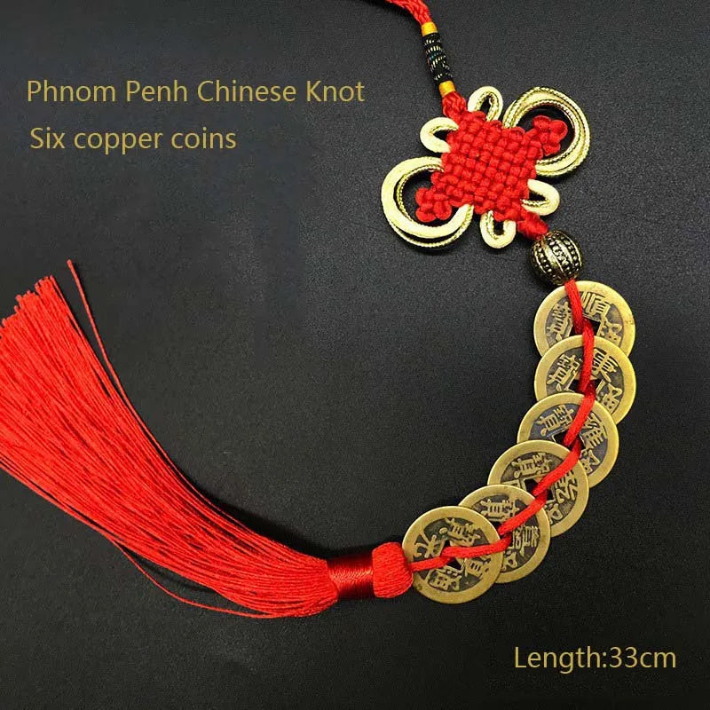 Red silk thread necklace featuring a gold knot and six antique copper coins.