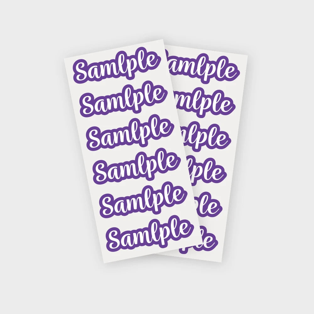 A stack of purple name stickers with the word sample repeated on each label.