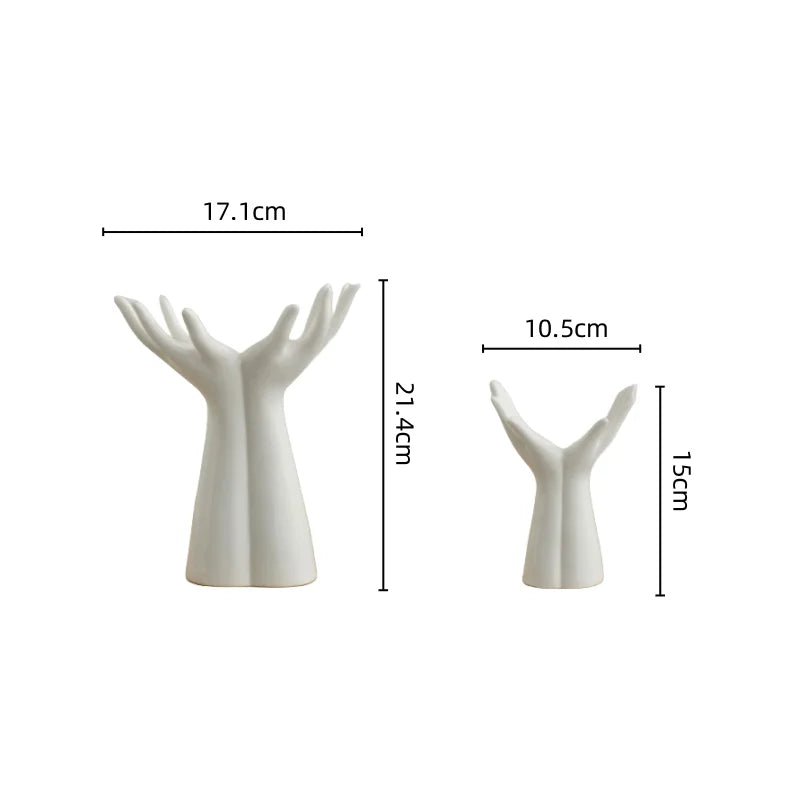 White ceramic hand vase with spread fingers, shown from the side and top view.