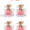 Four soy wax teddy bear candles in glass jars with ribbons