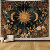 A vintage tapestry featuring a golden sun and crescent moon surrounded by dark foliage and floral patterns.