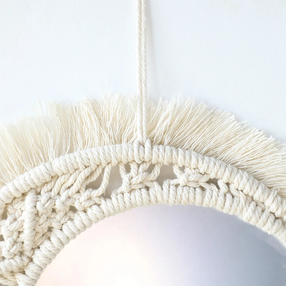 Boho macrame round wall mirror with a natural fiber fringe and woven texture