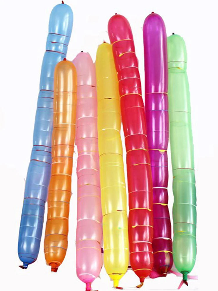 A collection of colorful latex rocket balloons in shades of blue, pink, yellow, and green.