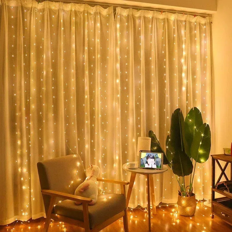A sheer cream curtain decorated with warm white fairy lights, illuminated in a room setting.