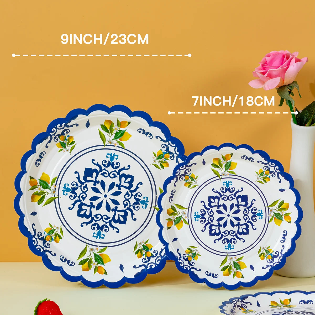 A set of blue floral lemon disposable paper plates with a scalloped edge and decorative pattern.