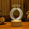 A white acrylic LED ring light shaped like a diamond is displayed on a wooden surface.