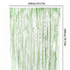 Vertical display of sage green wavy foil fringe curtain streamers in varying shades.