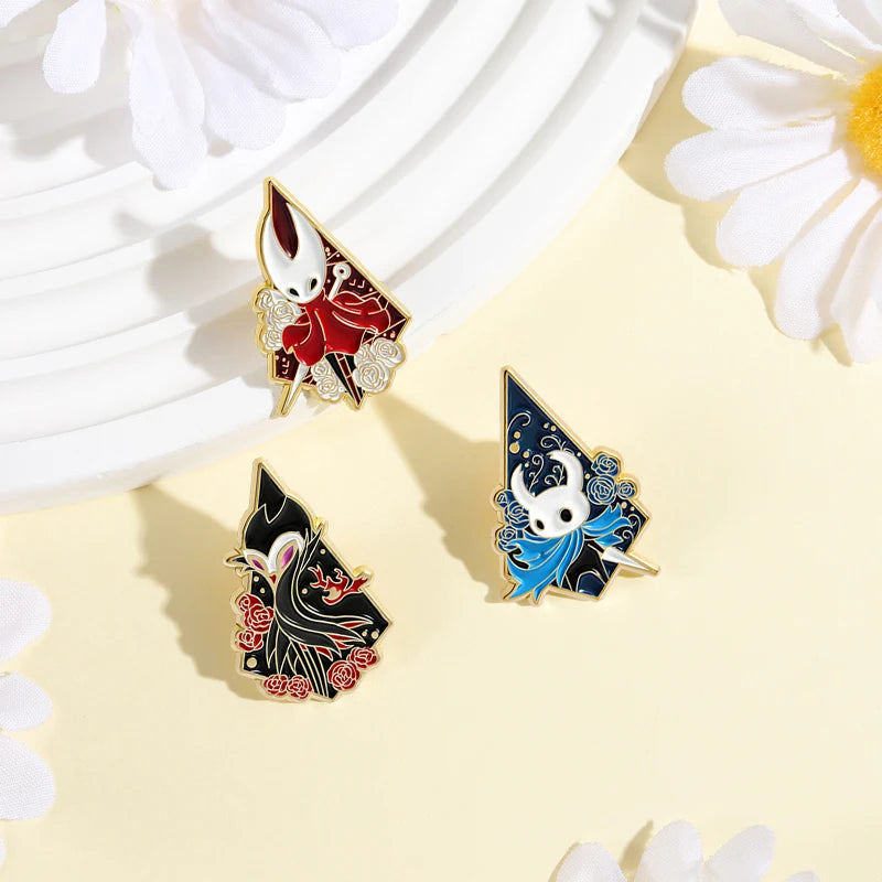 A set of enamel pins featuring cartoon cat designs with rude middle finger and daisy flower motifs.