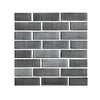 A rectangular pattern of dark gray 3D brick wall stickers.