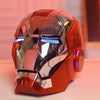 A metallic orange Iron Man MK5 wearable helmet with blue LED lights displayed on a surface.