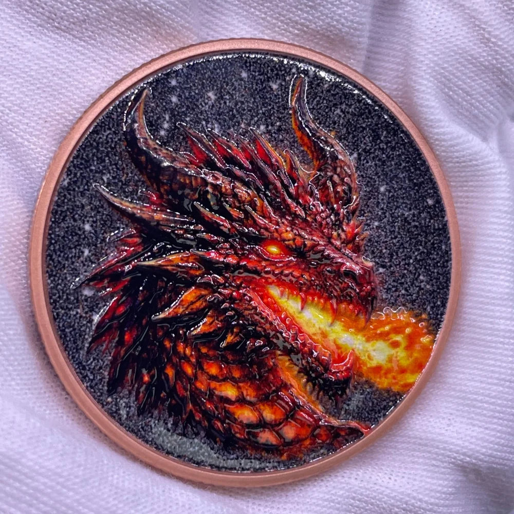 A round copper coin featuring a detailed, fiery dragon head design against a dark background.