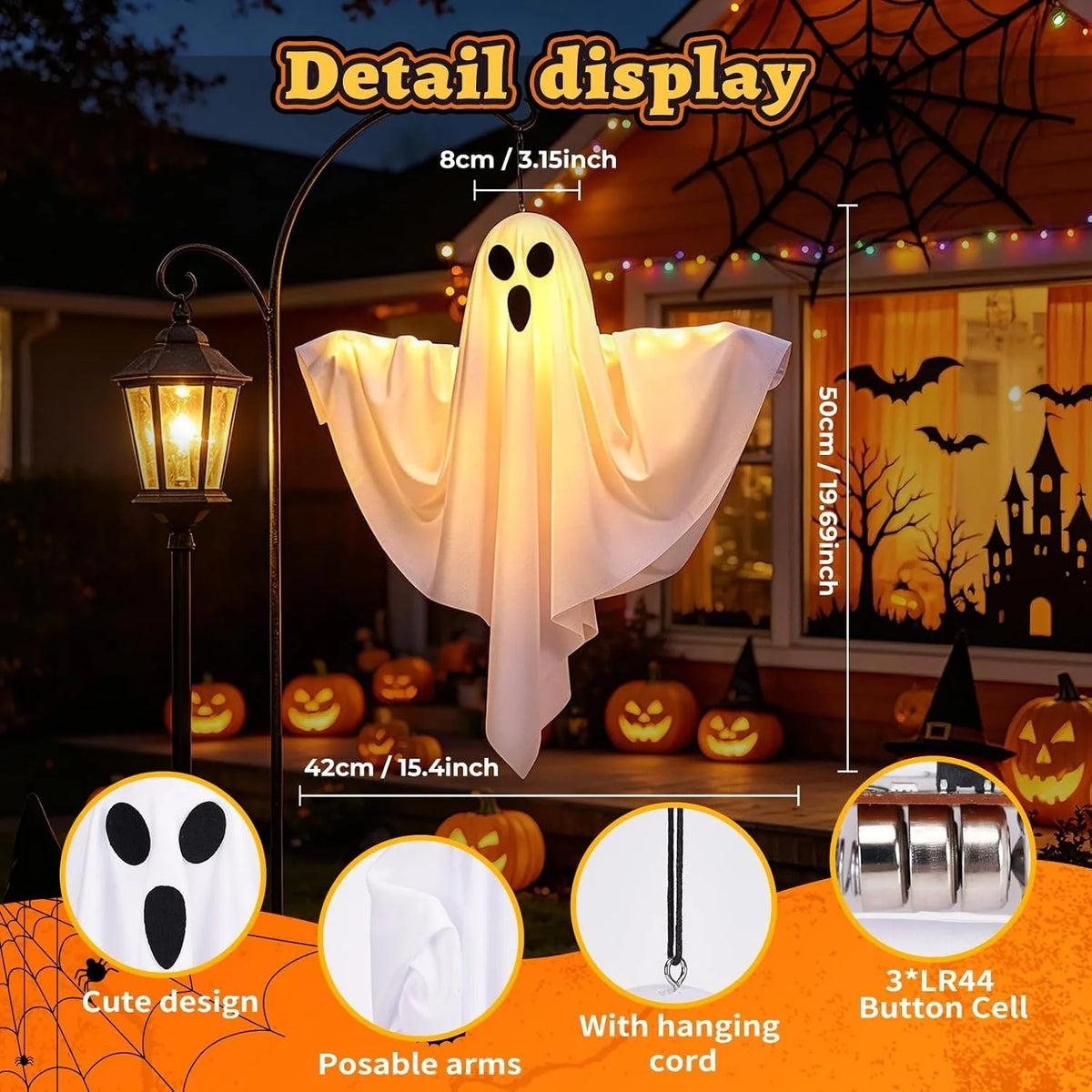 A white ghost decoration with flowing fabric is displayed next to a lantern and Halloween pumpkins.