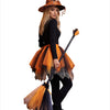 A woman dressed as a witch with a black outfit, orange tulle skirt, pointed hat, and a broomstick.