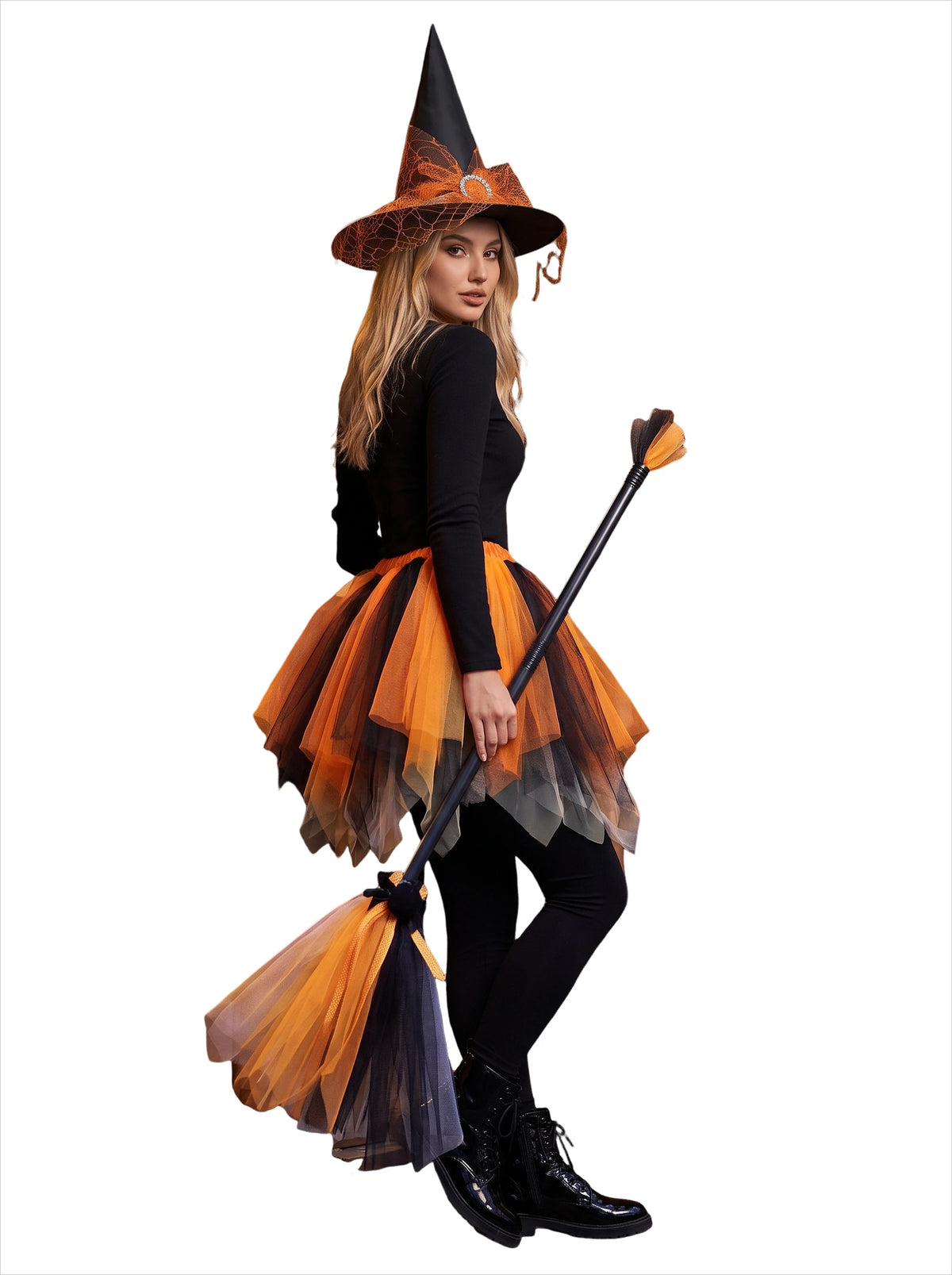 A woman dressed as a witch with a black outfit, orange tulle skirt, pointed hat, and a broomstick.