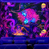 A dark tapestry featuring a vibrant purple and pink witch with glowing eyes, surrounded by skulls and mystical elements.