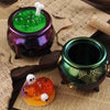 A collection of Halloween silicone molds, including a purple jar filled with green spheres and an orange pumpkin on a yellow 