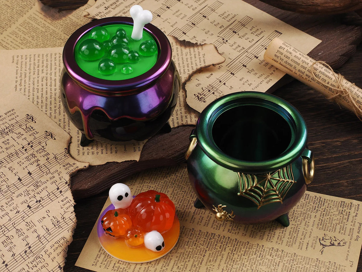A collection of Halloween silicone molds, including a purple jar filled with green spheres and an orange pumpkin on a yellow 