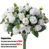 A bouquet of white silk roses and green eucalyptus leaves for wedding or home decor