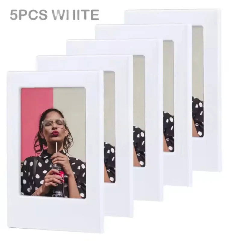 Five white magnetic mini photo frames displayed in a row.