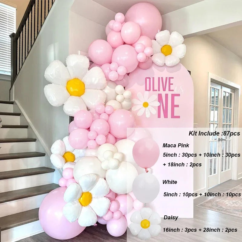 A kit of pink and white balloons forming a floral arch decoration for a staircase or wall display.
