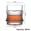 A clear whiskey glass with a heavy base and textured rim, showing a 300ml capacity.
