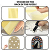 Sticker on the back of a puzzle showing various designs including a gold rectangle, a yellow shape, and a cat silhouette.