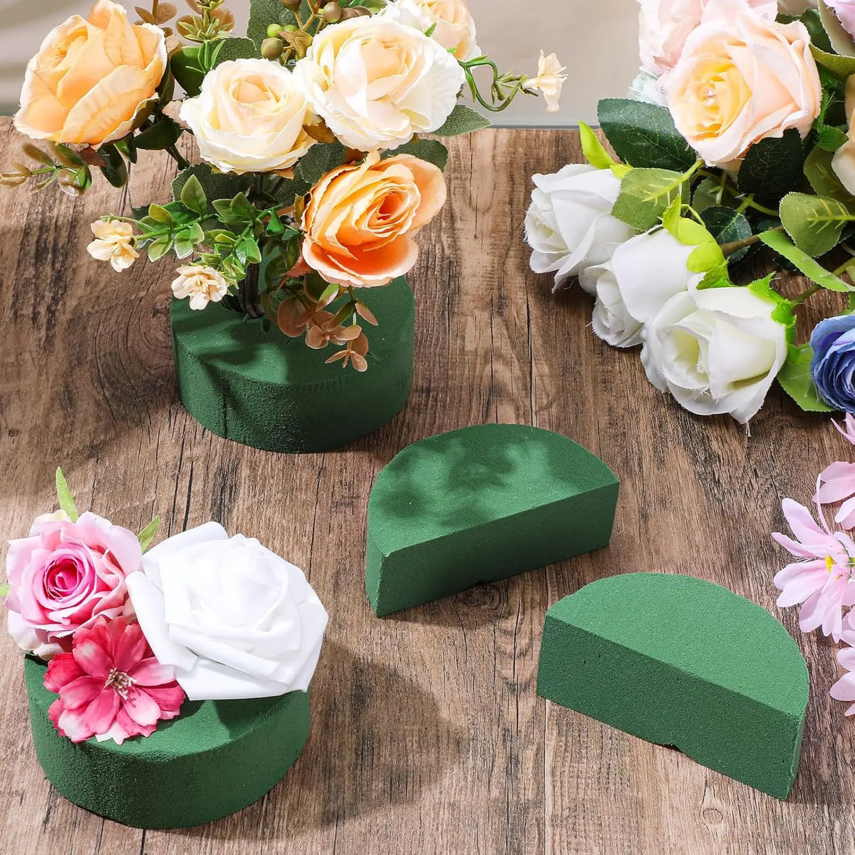 Green floral foam blocks with roses and greenery used for flower arrangements