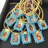 Handmade Virgin Mary Guadalupe gold-plated charm bracelet with blue beads and small framed charms