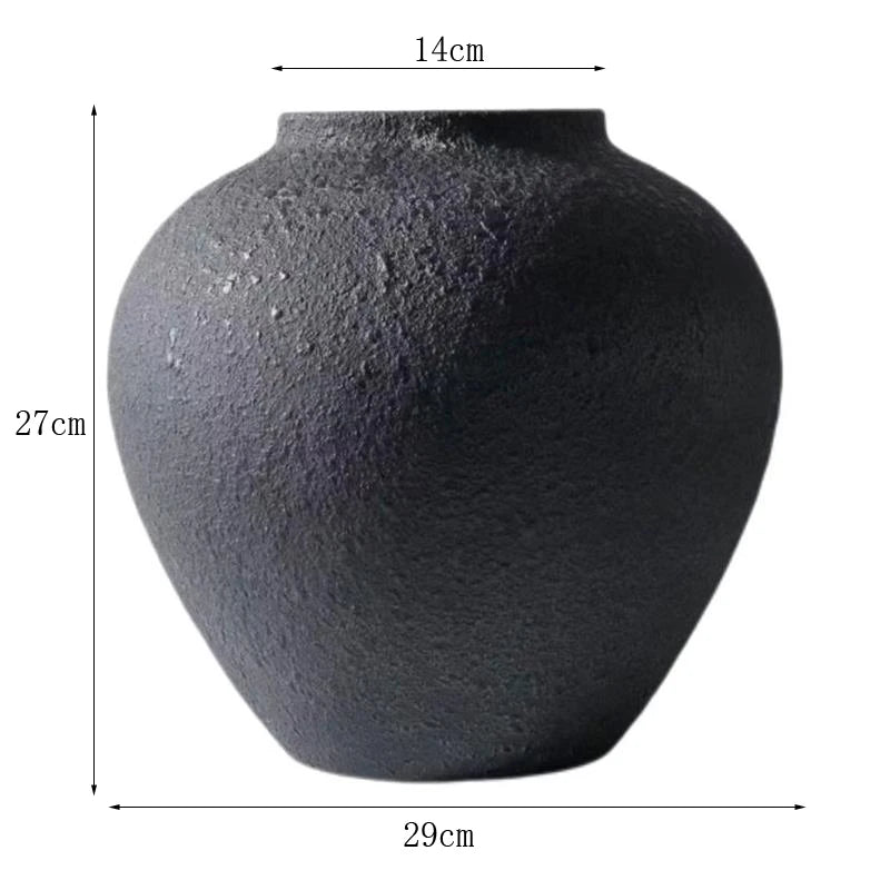 A dark gray rustic textured round vase with dimensions 14cm high and 29cm wide.