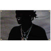 Silhouette of a person wearing a necklace and dark clothing against a dimly lit background.
