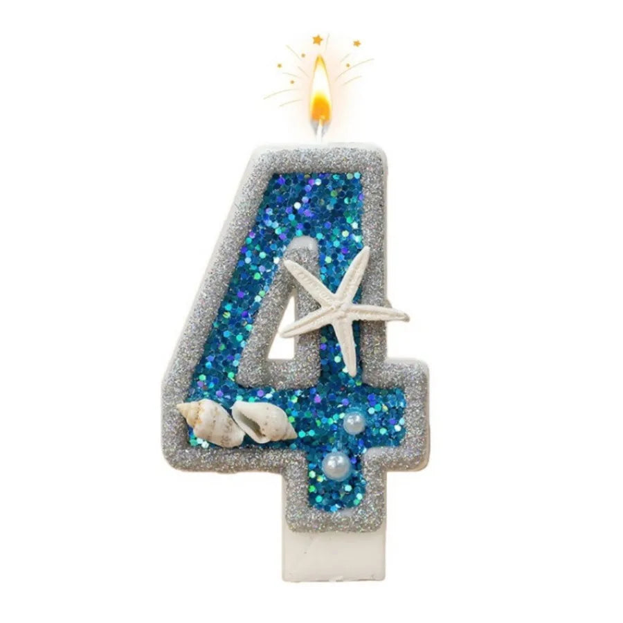 A birthday candle shaped like the number 4 covered in blue glitter and featuring a starfish decoration.