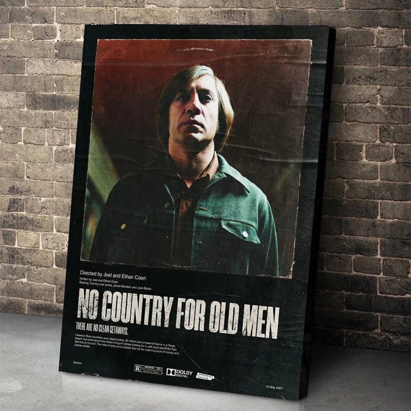 A framed poster featuring a man in a jacket with the title NO COUNTRY FOR OLD MEN