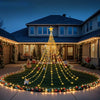 A house decorated with warm yellow string lights shaped like a star on the roof and surrounding landscaping.