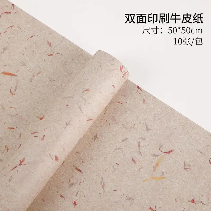 Roll of beige decorative packaging paper with floral petal prints for gifts and weddings