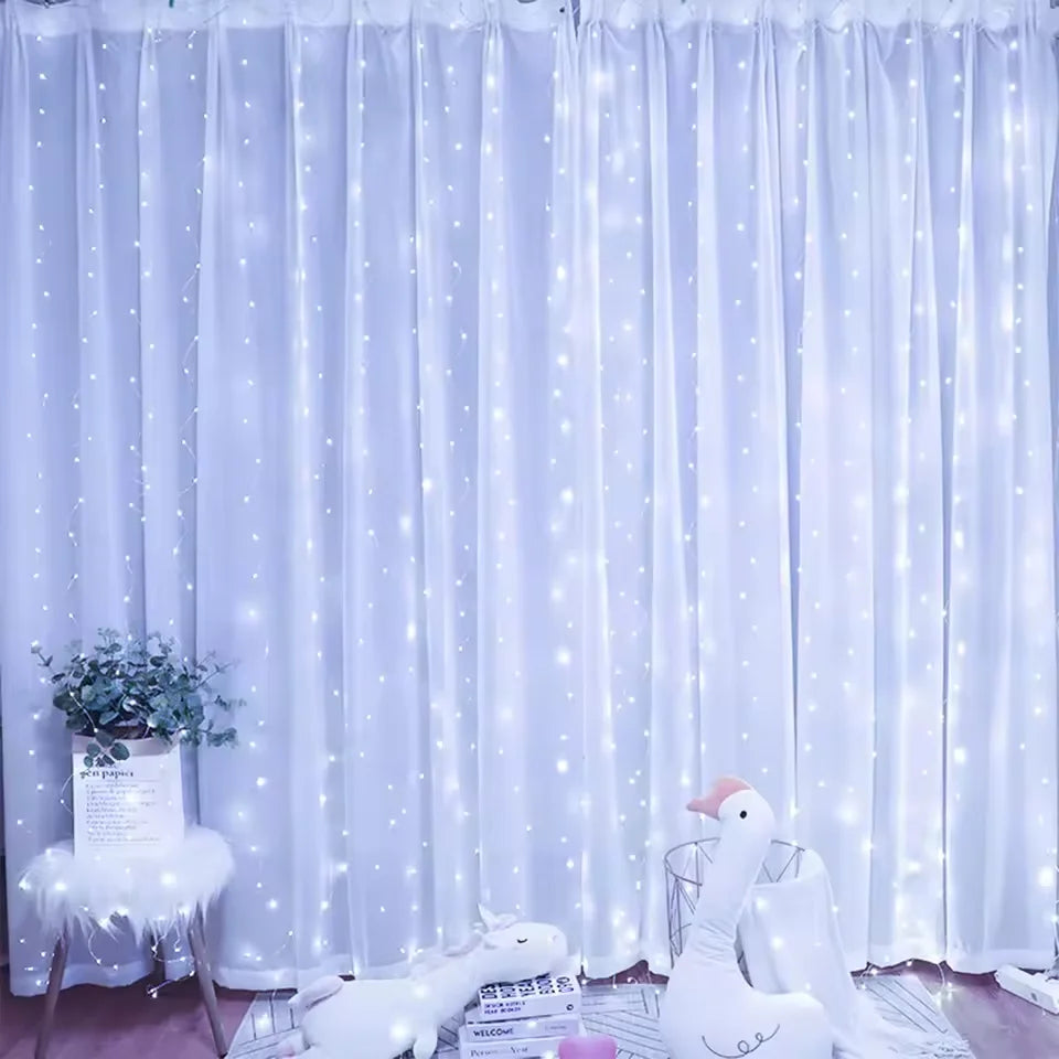 White LED curtain string lights illuminating a soft blue fabric backdrop with white accents and a dove-shaped decoration.