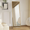 A tall floor mirror with a gold frame and vertical slats reflects a room interior.