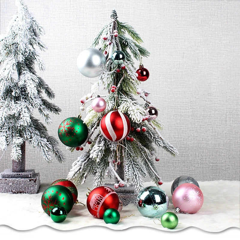 A decorated Christmas tree with various shiny ornaments including silver, red, and green balls.
