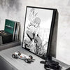 Anime wall art featuring a character in a dynamic pose with a chainsaw theme and a miniature model car.