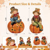Autumn scarecrow wooden tabletop decor set showing a figure in a hat and jacket sitting on an orange pumpkin